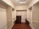 Spacious walk-in closet with built-in shelving and hardwood floors at 2558 Divine Sky Dr, Henderson, NV 89044