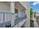 Charming balcony featuring a small table, blue railings and desert landscaping at 2725 S Nellis Blvd # 2052, Las Vegas, NV 89121