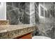 Modern bathroom featuring marble-style tile and granite countertops at 2725 S Nellis Blvd # 2052, Las Vegas, NV 89121