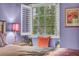Bedroom with shuttered window, colorful pillows, and artistic decor at 2725 S Nellis Blvd # 2052, Las Vegas, NV 89121