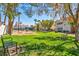 A well-maintained common area featuring picnic tables, mature landscaping and benches for relaxing at 2725 S Nellis Blvd # 2052, Las Vegas, NV 89121