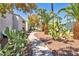 Beautifully landscaped community grounds with mature trees and walking path at 2725 S Nellis Blvd # 2052, Las Vegas, NV 89121