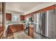 Kitchen showcasing stainless steel appliances, granite countertops, and dark wood cabinets at 2725 S Nellis Blvd # 2052, Las Vegas, NV 89121