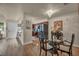 Open concept living area with views into the dining area and kitchen with wood laminate flooring at 2725 S Nellis Blvd # 2052, Las Vegas, NV 89121