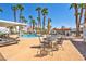 Community pool area with seating and shade umbrellas at 2725 S Nellis Blvd # 2052, Las Vegas, NV 89121