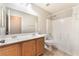 Well-lit bathroom features double sinks, shower over tub, and tile flooring at 2833 Swanson Ave, North Las Vegas, NV 89086