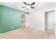 Cozy bedroom with neutral carpet, ceiling fan, and closet with shelving at 2833 Swanson Ave, North Las Vegas, NV 89086
