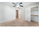 Bedroom with neutral carpet, ceiling fan, closet, and doorway at 2833 Swanson Ave, North Las Vegas, NV 89086
