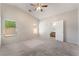 Spacious bedroom with vaulted ceiling, carpet floors, and natural light at 2833 Swanson Ave, North Las Vegas, NV 89086