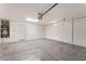Spacious garage with concrete flooring, garage door opener, and utility access at 2833 Swanson Ave, North Las Vegas, NV 89086