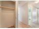 Hallway with closet and bathroom view, showcasing tile flooring at 2833 Swanson Ave, North Las Vegas, NV 89086