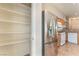 Pantry and kitchen featuring stainless steel refrigerator and white appliances at 2833 Swanson Ave, North Las Vegas, NV 89086
