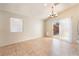 Eat-in kitchen featuring tile flooring, chandelier lighting fixture, sliding glass door to patio at 2833 Swanson Ave, North Las Vegas, NV 89086