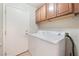 Laundry room equipped with washer, dryer, and overhead storage at 2833 Swanson Ave, North Las Vegas, NV 89086