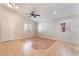 Open living area with light tile and laminate flooring, natural light and neutral tones at 2833 Swanson Ave, North Las Vegas, NV 89086