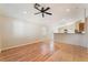 Bright living room featuring wood-look flooring and neutral walls, ceiling fan and natural light at 2833 Swanson Ave, North Las Vegas, NV 89086