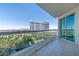 Enjoy city views from this balcony with glass railings and tile flooring overlooking green spaces at 2857 Paradise Rd # 802, Las Vegas, NV 89109