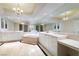 Luxurious bathroom with double vanity, jacuzzi tub, and large mirror, offering a spa-like experience at 2857 Paradise Rd # 802, Las Vegas, NV 89109