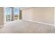 Large bedroom with neutral carpet, base trim and a sliding glass door leading to a balcony at 2857 Paradise Rd # 802, Las Vegas, NV 89109