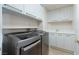 Efficient laundry room with modern appliances, white cabinets, and a utility sink at 2857 Paradise Rd # 802, Las Vegas, NV 89109