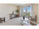 Cozy living room with neutral carpet, seating area, and a sliding door to a private balcony at 2857 Paradise Rd # 802, Las Vegas, NV 89109