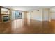 Spacious living room featuring hardwood floors, a fireplace, and sliding glass doors to the balcony at 2857 Paradise Rd # 802, Las Vegas, NV 89109