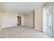 Spacious living room with neutral carpet and a sliding glass door leading to a balcony at 2857 Paradise Rd # 802, Las Vegas, NV 89109