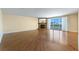 Bright living room with hardwood flooring, a fireplace, and large sliding glass doors with access to balcony at 2857 Paradise Rd # 802, Las Vegas, NV 89109