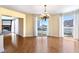 Open-concept living area featuring hardwood floors, large windows, and a fireplace, perfect for entertaining at 2857 Paradise Rd # 802, Las Vegas, NV 89109