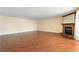 Spacious living room with hardwood floors, a fireplace, and bright natural lighting at 2857 Paradise Rd # 802, Las Vegas, NV 89109