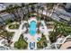Aerial view of a luxurious pool area with lush landscaping, seating, and palm trees at 2857 Paradise Rd # 802, Las Vegas, NV 89109
