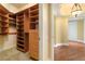 Custom walk-in closet with drawers and shelving adjoining a room with hardwood floors at 2857 Paradise Rd # 802, Las Vegas, NV 89109
