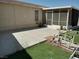 Backyard featuring a spacious concrete patio and an enclosed sunroom at 2920 Malibou Ave, Pahrump, NV 89048