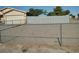 Chain link fence securing a large gravel backyard at 2920 Malibou Ave, Pahrump, NV 89048