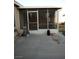 View of the screened-in patio, with the house and backyard in the background at 2920 Malibou Ave, Pahrump, NV 89048