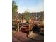 Backyard oasis featuring a charming wooden bridge and tranquil water feature at 2920 Malibou Ave, Pahrump, NV 89048
