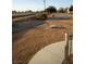 Spacious yard with attractive landscaping features, a drought-tolerant aesthetic and gravel beds at 2920 Malibou Ave, Pahrump, NV 89048