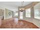 Dining area with hanging chandelier and view of the pool at 2929 Haddon Dr, Las Vegas, NV 89134