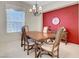 Well-lit dining room featuring a chandelier and large wooden table with chairs at 2929 Haddon Dr, Las Vegas, NV 89134