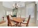 Cozy dining room area with chandelier lighting and decorative window trim at 2929 Haddon Dr, Las Vegas, NV 89134
