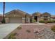 Charming single-story home with a desert landscaped front yard and attached two car garage at 2929 Haddon Dr, Las Vegas, NV 89134