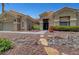 Inviting single-story home featuring a meticulously landscaped front yard with rock accents and a garden at 2929 Haddon Dr, Las Vegas, NV 89134