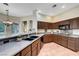 Spacious kitchen with dark cabinetry, breakfast bar, and stylish tile flooring at 2929 Haddon Dr, Las Vegas, NV 89134