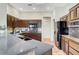 Bright kitchen with dark cabinets and stainless steel appliances, ample counter space at 2929 Haddon Dr, Las Vegas, NV 89134