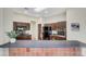 Open kitchen featuring a breakfast bar, dark cabinetry and modern appliances at 2929 Haddon Dr, Las Vegas, NV 89134