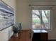 Bright home office featuring a wood desk, large window with outdoor views, and neutral décor at 2929 Haddon Dr, Las Vegas, NV 89134