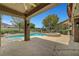 Open patio overlooking the backyard pool and spa with views of the golf course and desert landscape at 2929 Haddon Dr, Las Vegas, NV 89134