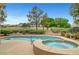 Backyard pool and spa area with a view of the golf course, perfect for relaxing or entertaining at 2929 Haddon Dr, Las Vegas, NV 89134
