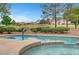 Inviting pool and spa with golf course views and desert landscaping, creating a serene outdoor experience at 2929 Haddon Dr, Las Vegas, NV 89134