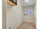 Compact room featuring a tiled floor, a small window, and neutral wall decor at 2929 Haddon Dr, Las Vegas, NV 89134